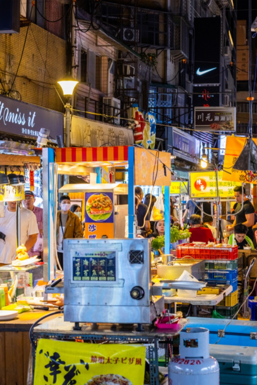 Taipei: 2-Hour Raohe Night Market Walking Tour - What You’ll Learn at the Sea Goddess and Songshan Temple Stops