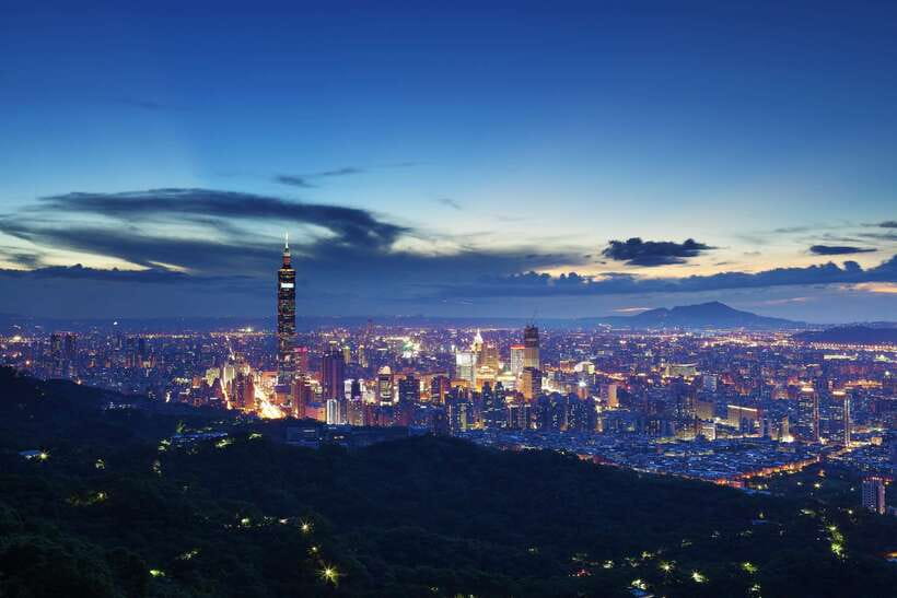 Taipei 101 above the city skyline at blue hour